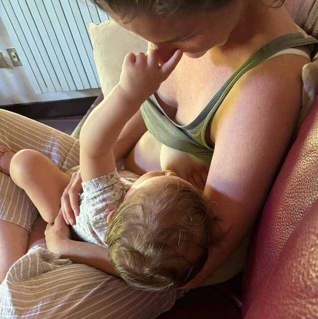 Mother breastfeeding child